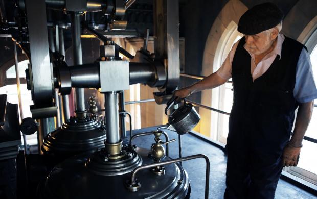 Darlington and Stockton Times: PUMP: Volunteer Richard Doran oils the pistons during the open day at the Tees Cottage Pumping Station in Darlington. Picture: STUART BOULTON..
